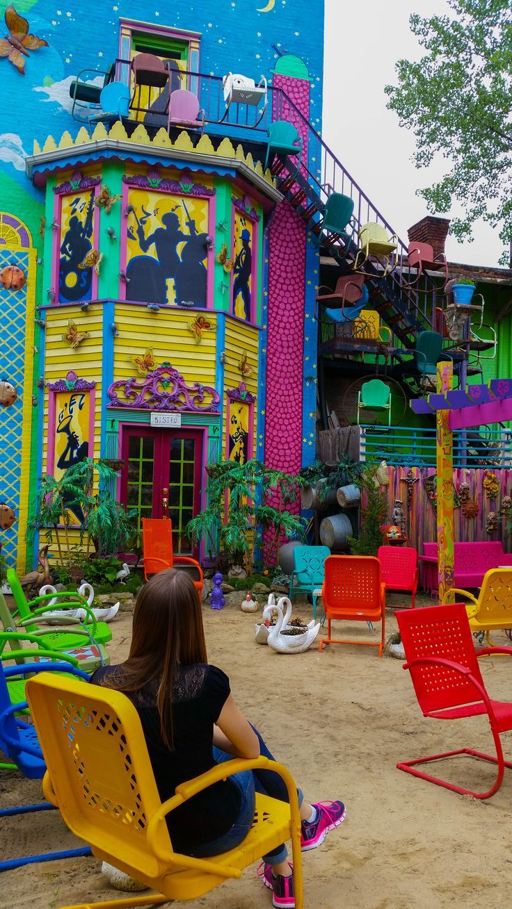 person sitting in chair at randyland